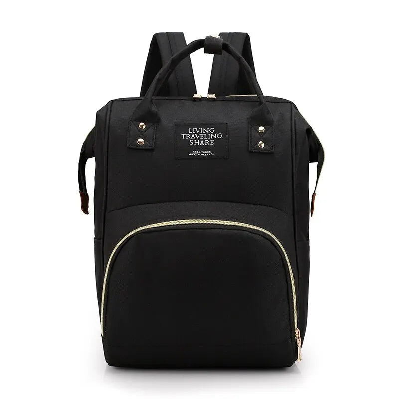 Black diaper backpack with top handles, zipper front pocket, and shoulder straps.