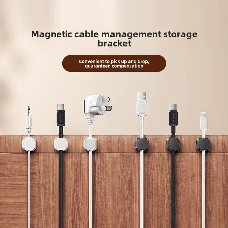row of magnetic desk clips spaced row of magnetic edge cable docks mounted on a wood panel organizing multiple connector types including usb-c lightning aux and plug adapters