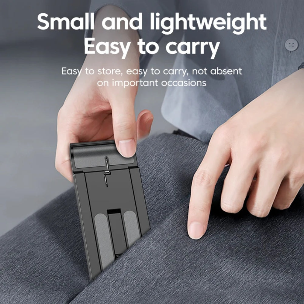 Compact foldable phone stand being slipped into a pants pocket for portability