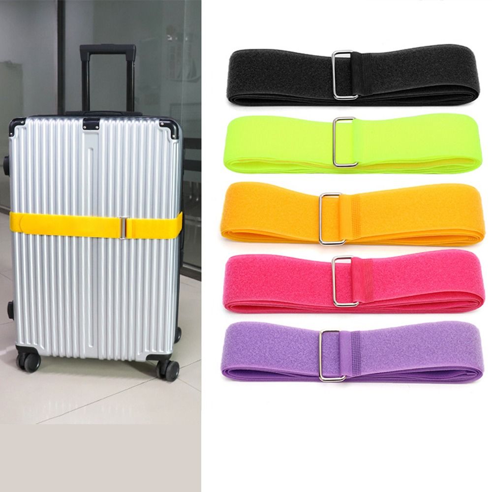 Yellow luggage strap fastened to a metallic suitcase, with a vertical display of strap color options beside it.
