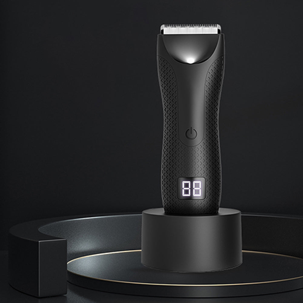 Sleek black electric trimmer on a dark podium display, featuring digital screen and textured grip.