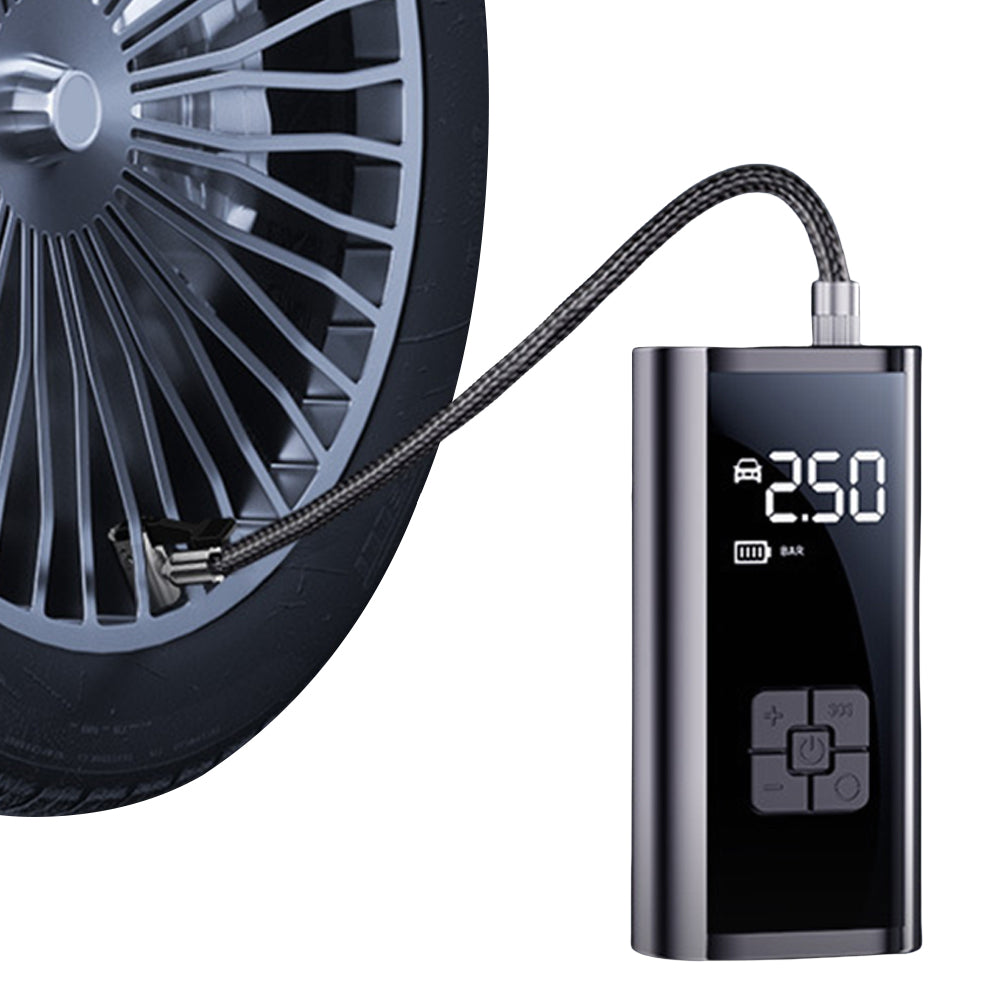 Compact electric air pump inflating a car tire with digital display showing pressure