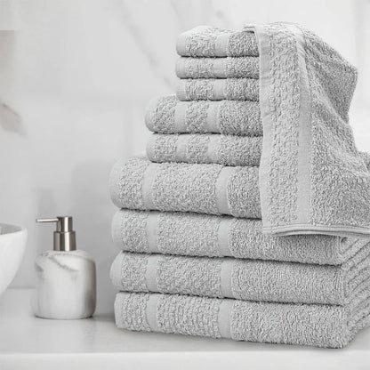 10 Piece Stack of gray towels of different types on a bathroom counter with a soap dispenser.