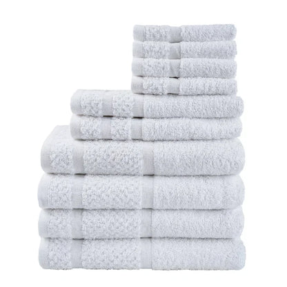 10 Piece Stack of white towels of different sizes  on a white back ground. 