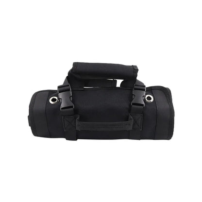 Rolled-up black tool roll organizer with padded handle, buckle straps, and metal grommets for hanging, designed for easy transport and secure storage.