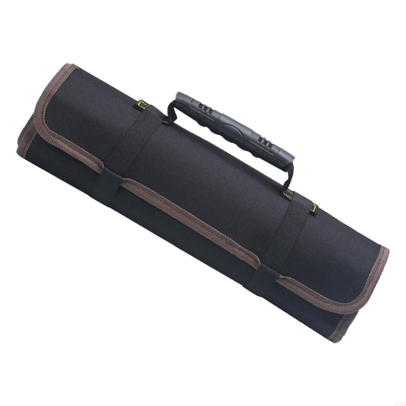A cylindrical black tool roll with reinforced brown trim, tightly rolled and secured with two straps. The side handle is textured for easy grip, making it ideal for mechanics or technicians.