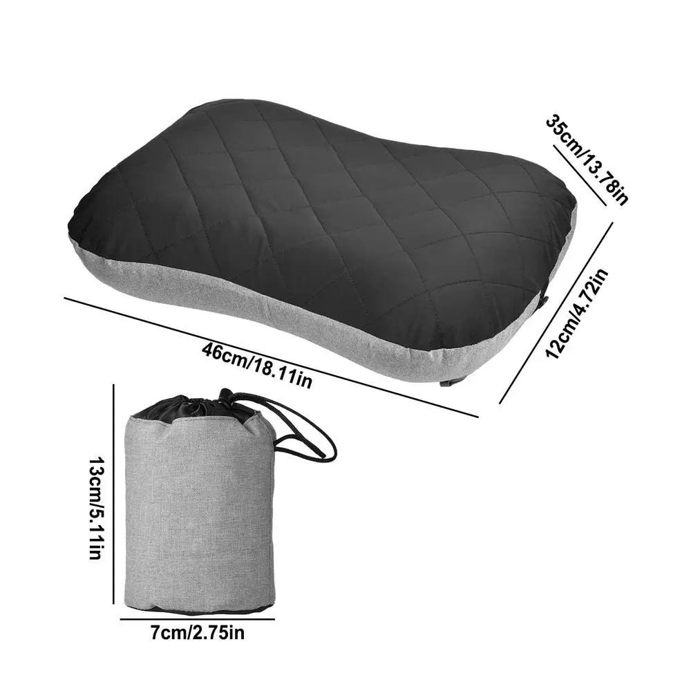 Black inflatable camping pillow with light gray base, shown with dimension markers illustrating its size: 46 cm long, 35 cm wide, and 12 cm thick. Also included is the compact gray drawstring storage bag with measurements of 13 cm height and 7 cm diameter, emphasizing portability and space-saving features.