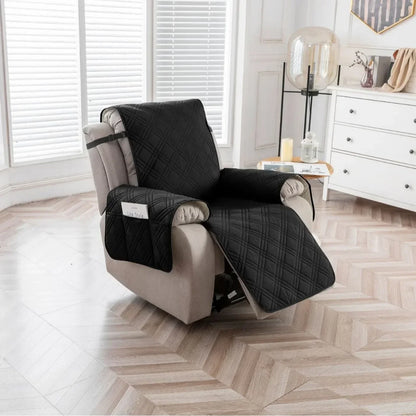 Black quilted recliner chair cover with side pocket fitted on a beige recliner in a modern living room with wood flooring and white cabinetry