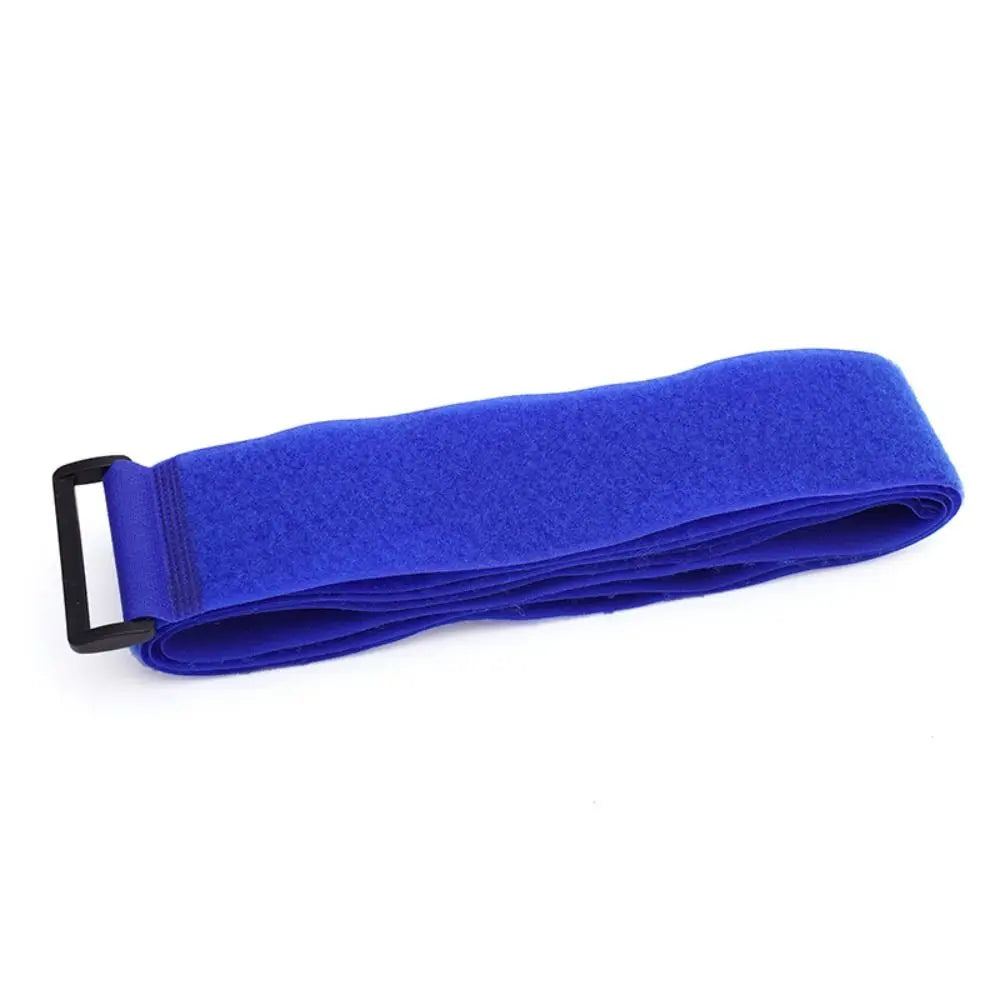Folded Blue adjustable luggage strap with buckle made from nylon and hook-and-loop fastening.