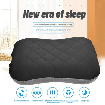 Marketing banner with the text “New era of sleep” above a close-up of the black inflatable pillow on a soft indoor background. The bottom of the image features five blue icons with captions: comfortable fabrics, soft and elastic, moisture absorption and breathability, health and environmental protection, and sleep well—highlighting the pillow’s comfort and quality.