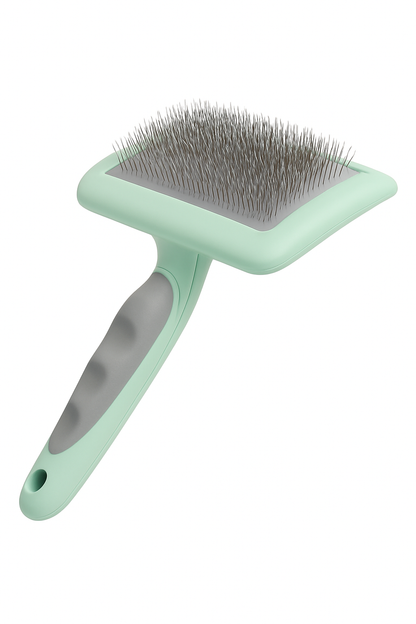 Mint green cat grooming brush with ergonomic green grip on a white background