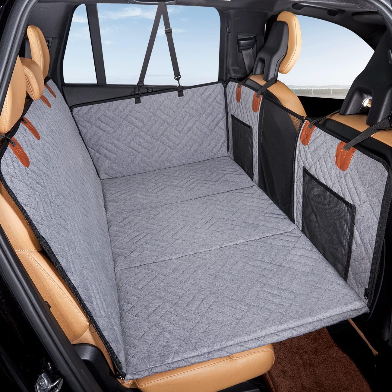 gray quilted hammock dog seat cover installed with mesh pockets and door-protection flaps
