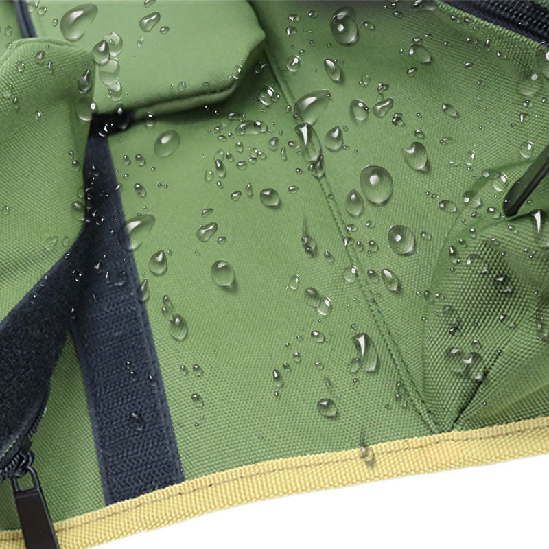 Green tool bag showcasing water resistant feature with water droplets on up close section of the tool. 