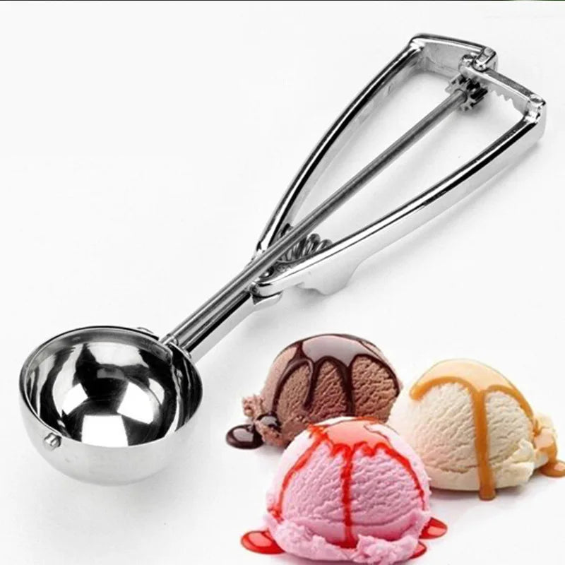 Stainless steel ice cream scoop positioned next to three scoops of ice cream with toppings, illustrating its use in food preparation.