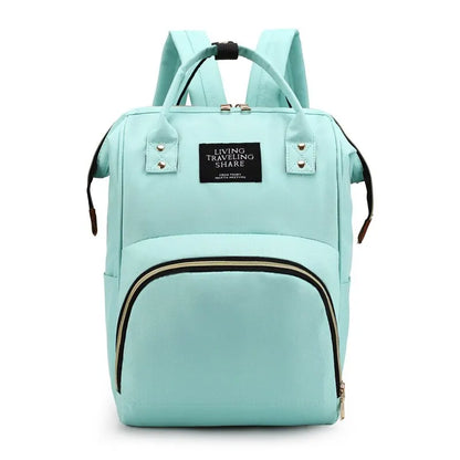 Light aqua blue backpack with black zipper accents and top handles.
