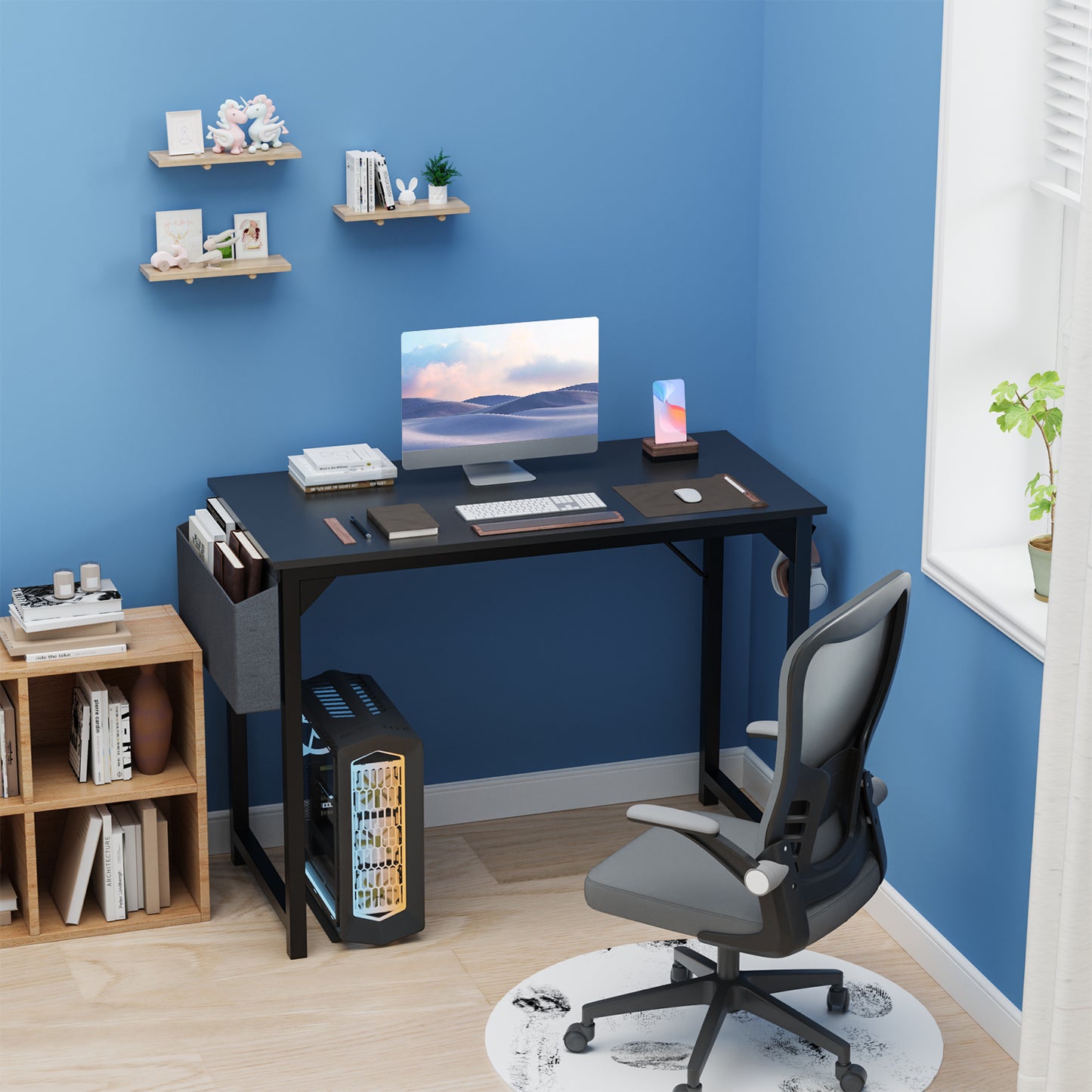 Modern home office with a desk, chair, and computer setup against a blue wall.