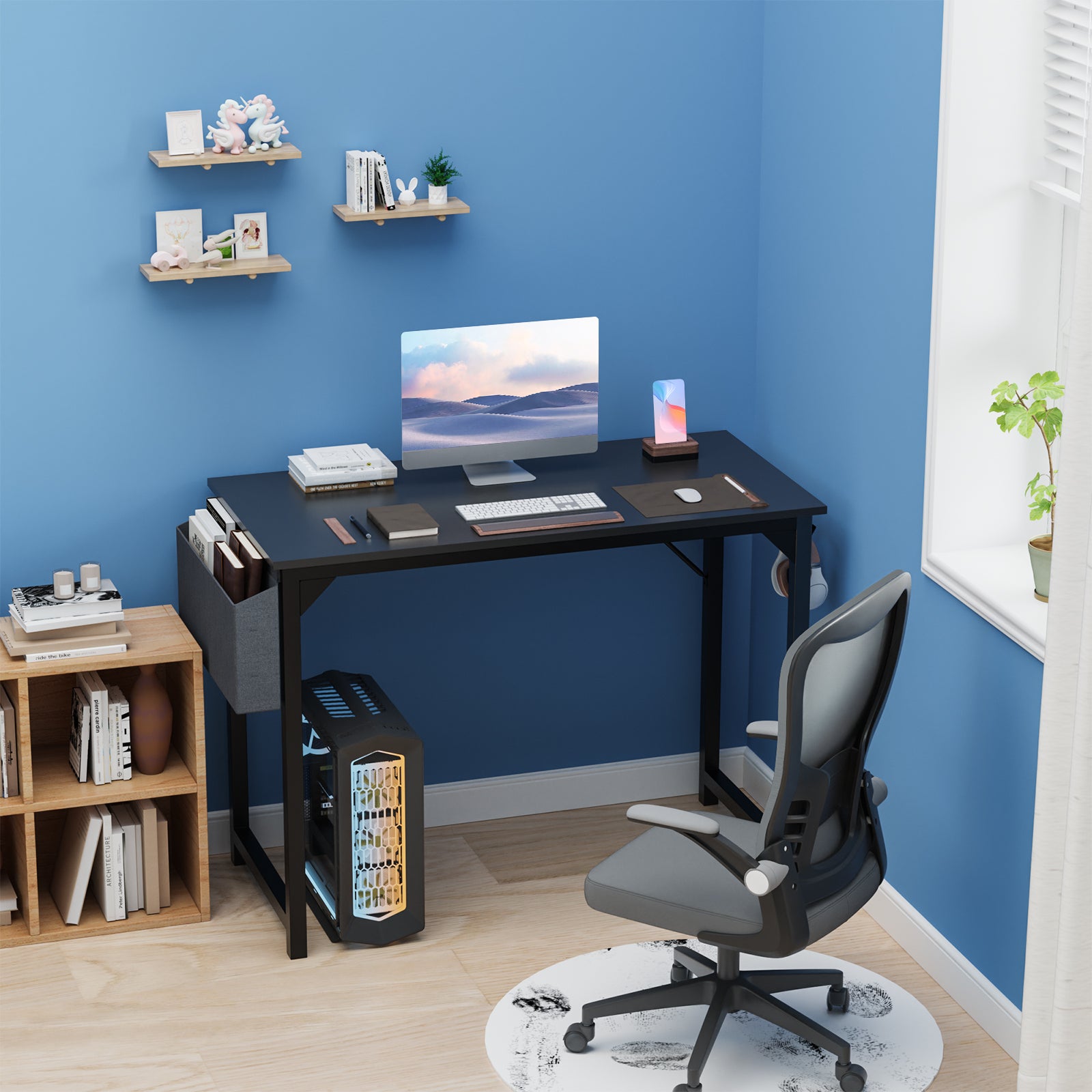 Modern home office with a desk, chair, and computer setup against a blue wall.