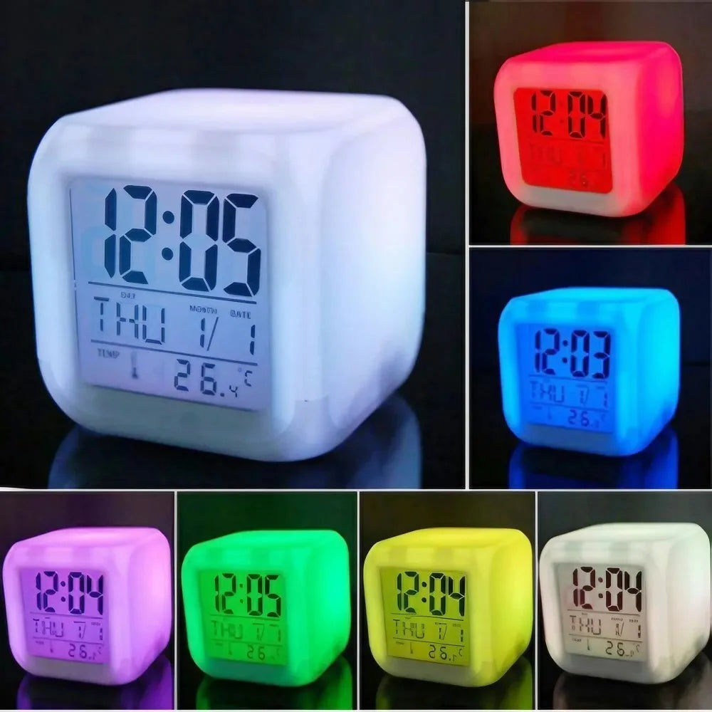 A collection of cube-shaped digital LED alarm clocks glowing in colors like red, green, blue, pink, and yellow, each showing time, date, and temperature with a clear backlit screen.