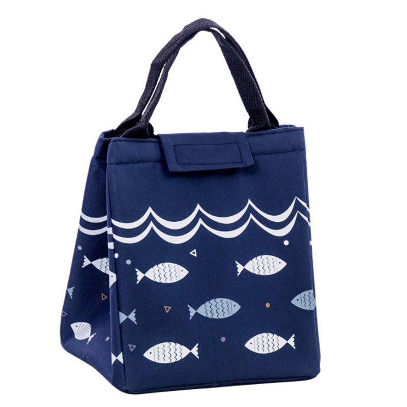 Close-up of a navy blue insulated lunch bag with fish design.