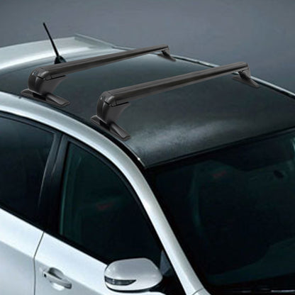 two black roof rack cross bars secured to a dark gray vehicle roof, antenna visible at rear