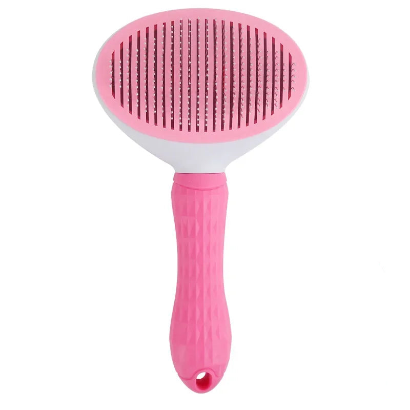 Pink grooming brush with stainless steel bristles and a soft-grip handle, ideal for detangling pet hair and reducing shedding.