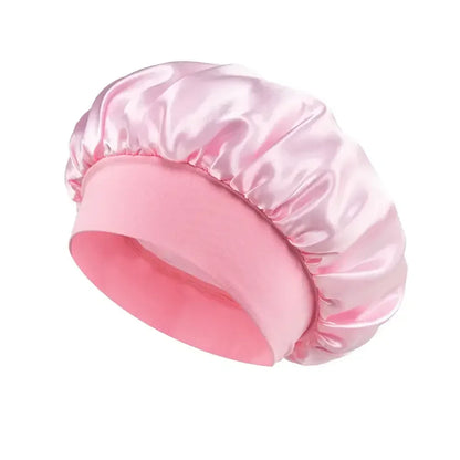 Light pink satin hair bonnet with a soft stretch band for nighttime hair care