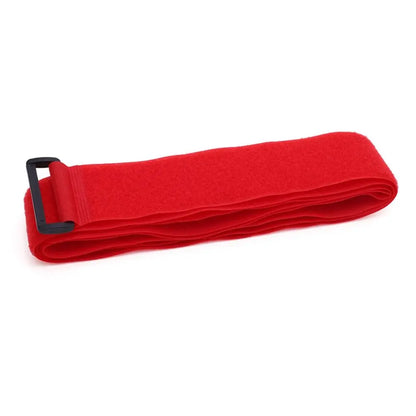 Folded Red adjustable luggage strap with buckle made from nylon and hook-and-loop fastening.