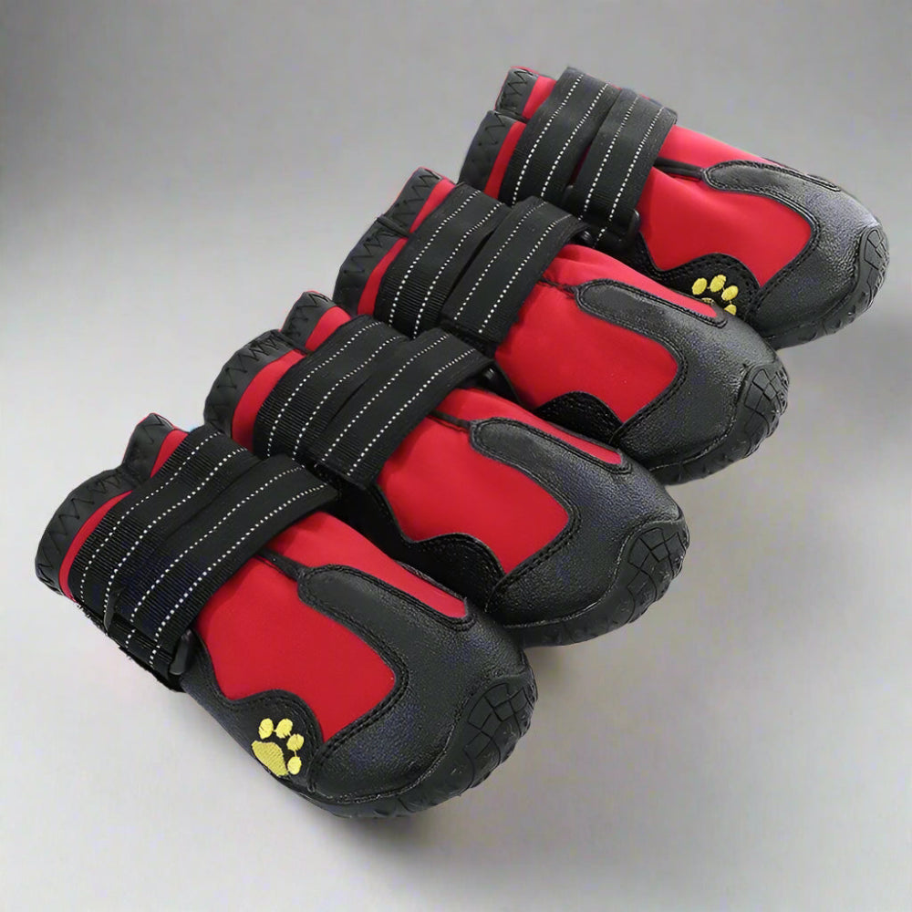 4 pc Red & black, Waterproof dog boots for medium and large dogs, featuring anti-slip soles, reflective strips for visibility, and adjustable straps for a secure fit. Ideal for rain, snow, and rough terrain.