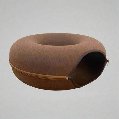 Brown Donut-shaped cat bed with a built-in interactive tunnel, made from durable felt for comfort and play. Ideal for cats who love cozy resting spots and active exploration.