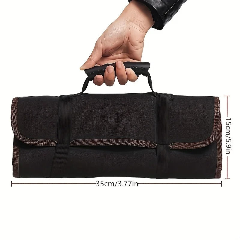 A person holding the tool roll bag using the reinforced plastic handle. The bag is rolled up, showing its compact size of 35cm width and 15cm height, ideal for hand-carry tool transport.