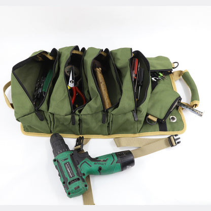 Fully unrolled green tool organizer displaying multiple zippered compartments filled with tools such as pliers, screwdrivers, and a drill.