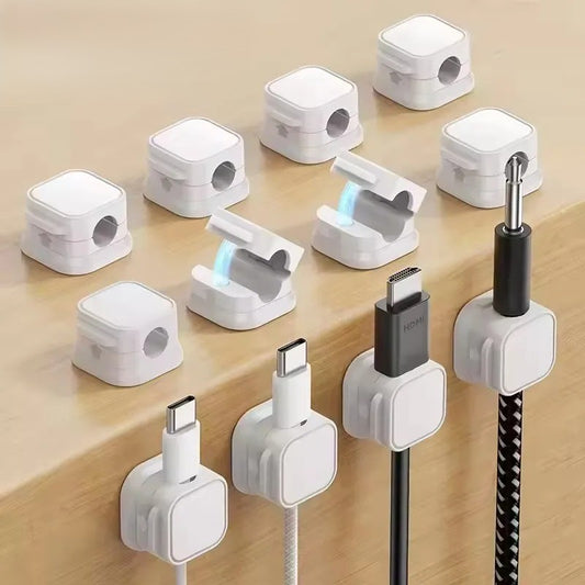 set of twelve white magnetic edge cable docks mounted on a tabletop organizing usb-c hdmi and 6.35mm adapter cables