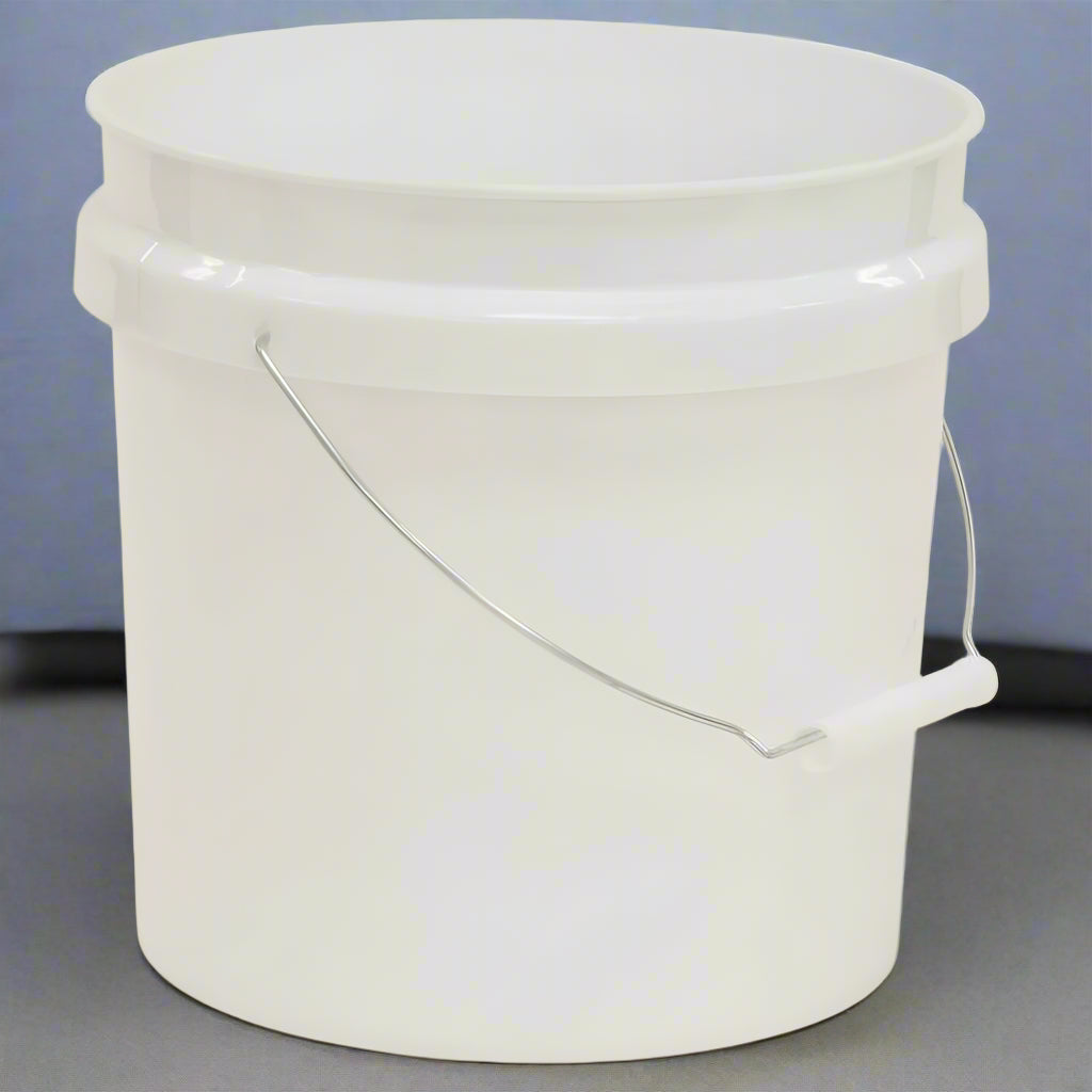 White plastic bucket with a handle on a gray background
