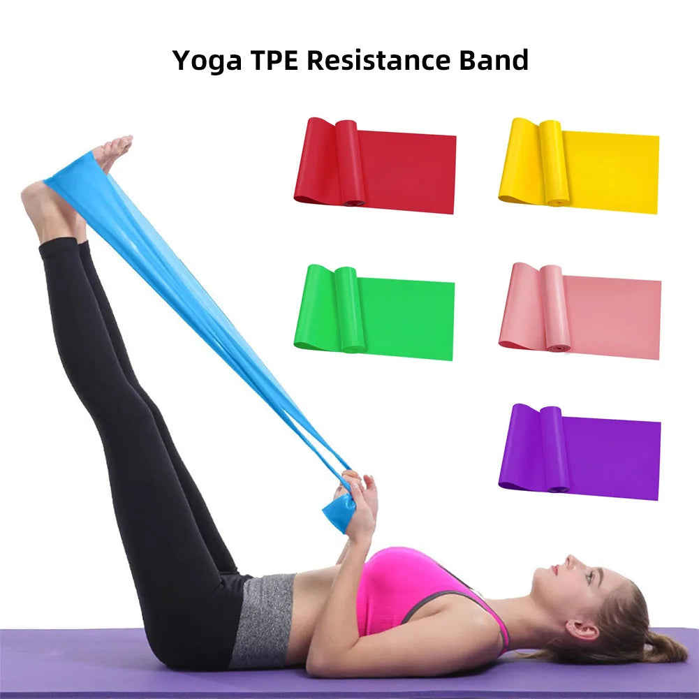 A woman lying flat on a purple yoga mat, using a blue resistance band looped around her feet for a hamstring stretch. The top of the image displays alternate color options of the band — red, green, pink, yellow, and purple — in rolled-out form, indicating the variety available for different preferences or resistance levels. Text at the top reads "Yoga TPE Resistance Band."