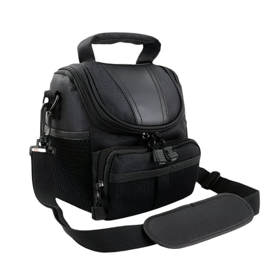 Angled top view of a black waterproof camera bag showing durable stitching, zippered compartments, and an ergonomic shoulder strap pad.