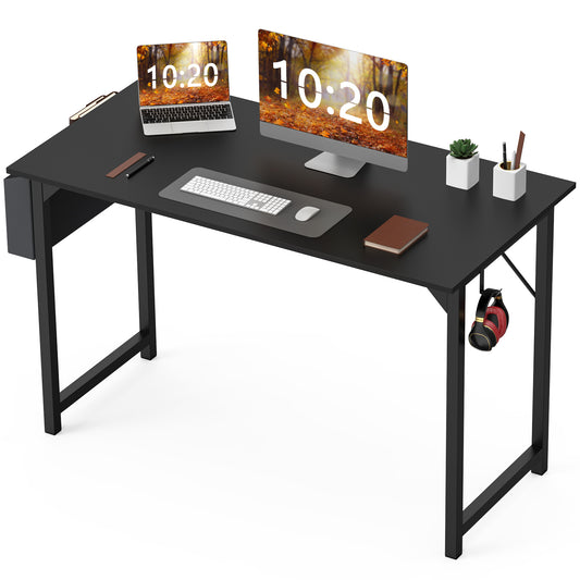 Wide black computer desk setup with dual monitors, headphone hook, and desktop accessories
