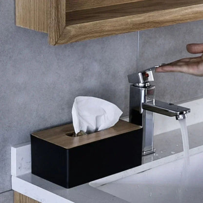 black tissue box with bamboo lid by bathroom sink