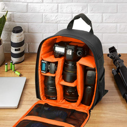 Camera gear packed in backpack on a desk