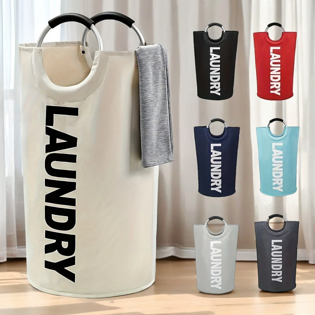 A cream-colored cylindrical laundry basket with a gray towel draped over one handle, placed in a softly lit indoor setting. The image also displays six additional color options—black, red, navy blue, light blue, light gray, and dark gray—on the right side.
