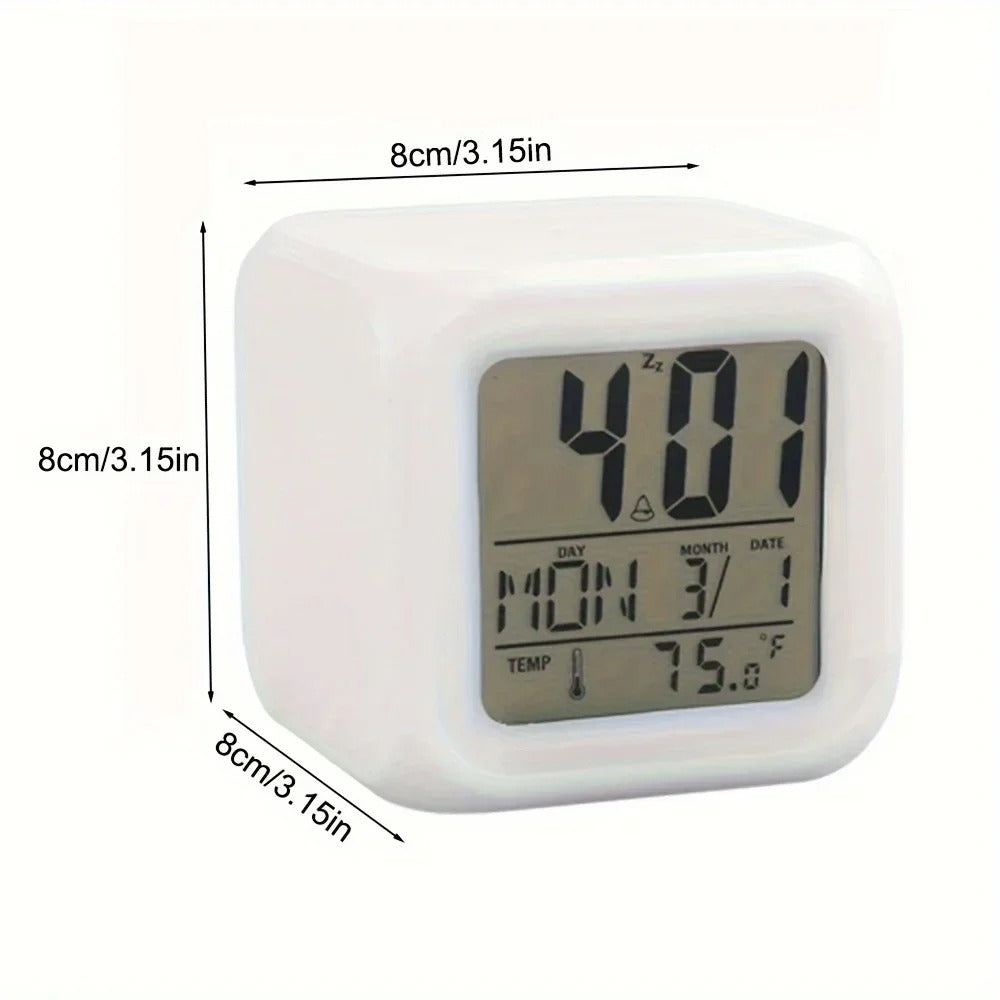 White cube-shaped digital alarm clock with a clear LCD screen displaying the time (4:01), day (Monday), date (3/1), and temperature (75.6°F). The clock measures 8 cm (3.15 inches) on all sides, as shown by labeled dimension arrows. Ideal for bedside use with multifunctional display features.