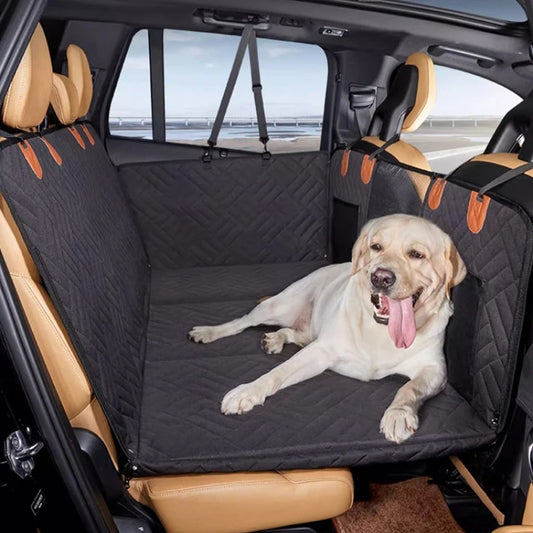 black quilted back-seat dog bed hammock with rigid front support; labrador lying comfortably; door flaps and mesh pocket visible in SUV