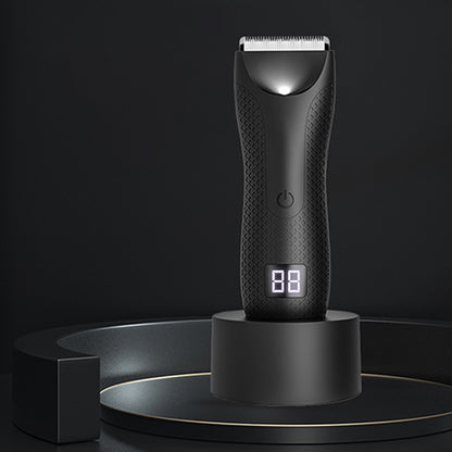 Sleek black electric trimmer on a dark podium display, featuring digital screen and textured grip.