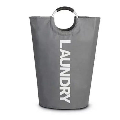 A gray laundry hamper with silver ring handles and the word "LAUNDRY" printed vertically in white on the front, displayed on a white background. The sturdy cylindrical shape and compact size are clearly shown.