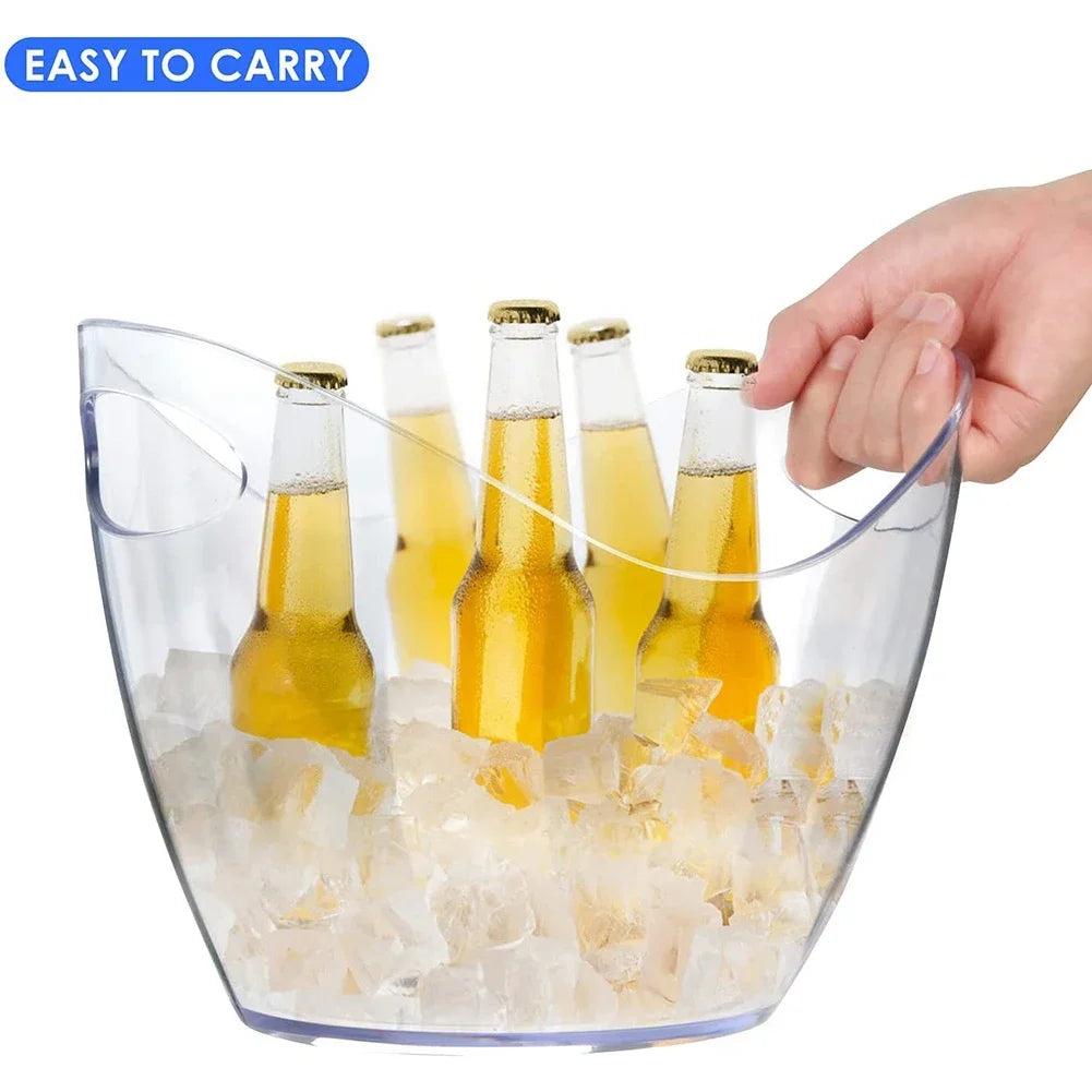 A hand gripping the handle of a clear plastic ice bucket loaded with ice and six bottled beers, emphasizing portability and drink storage for parties or bar use.