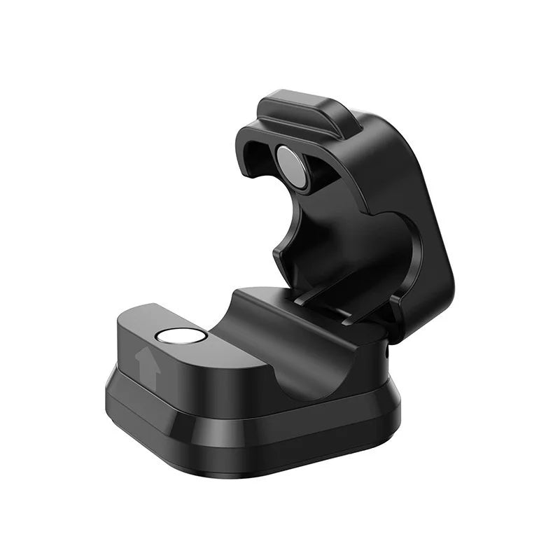 open black magnetic edge-mount cable dock for desk cable management, showing hinged clip with round magnet and flat adhesive base with arrow marker