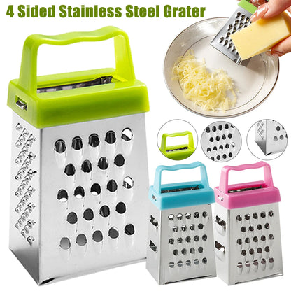 Mini 4-sided stainless steel box grater with green handle placed on a wooden board, next to shredded cheese and mozzarella ball