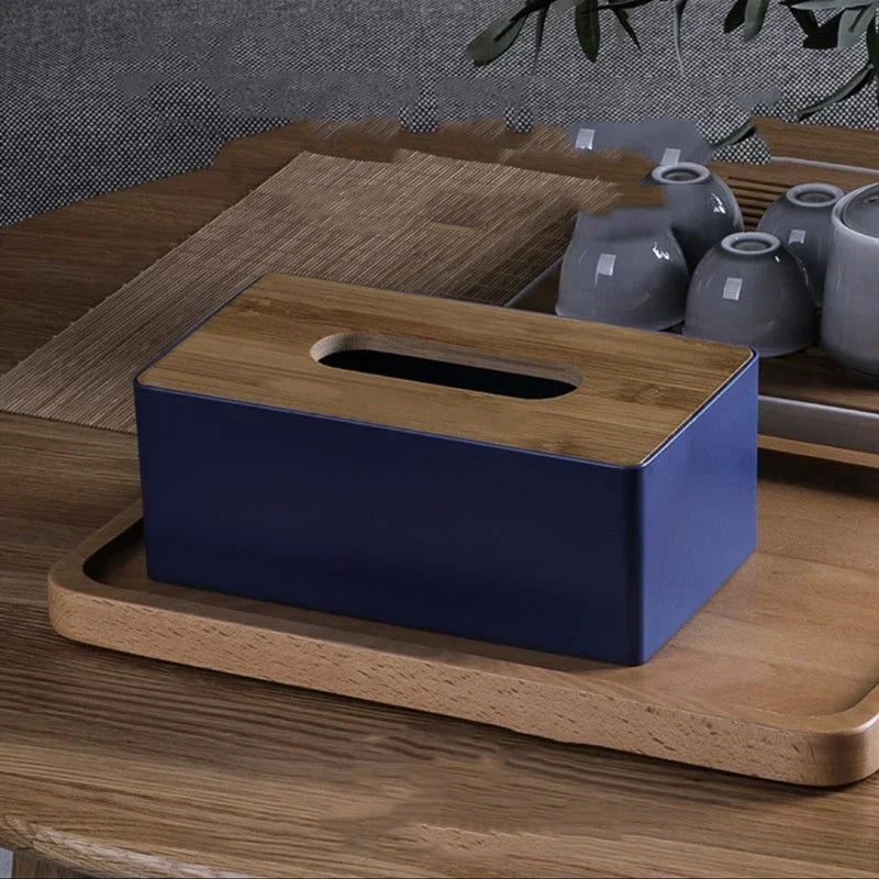 navy blue tissue box with bamboo lid on tray