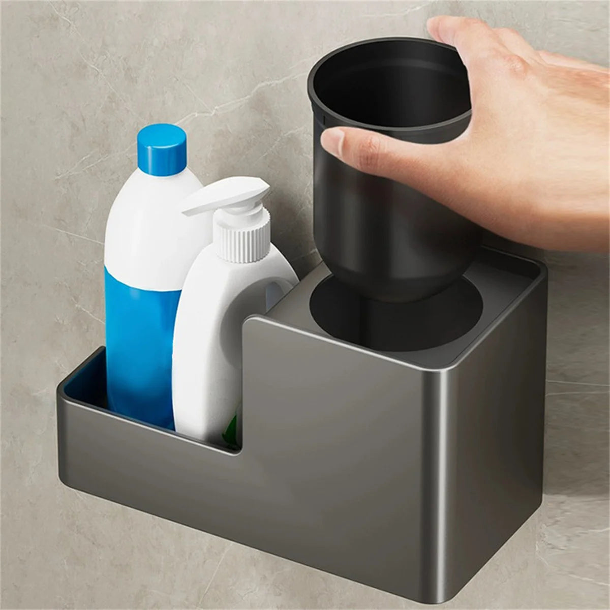 Hand placing inner container into toilet brush holder with products beside it