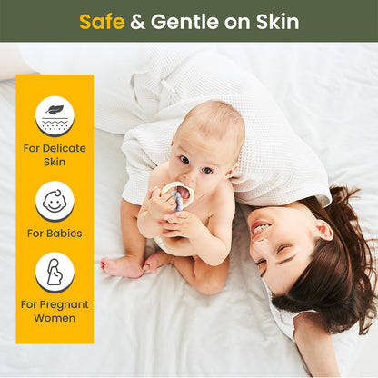 Mother and baby lying on Fairpeak waterproof mattress protector, showing it’s safe and gentle for delicate skin, babies, and pregnant women.