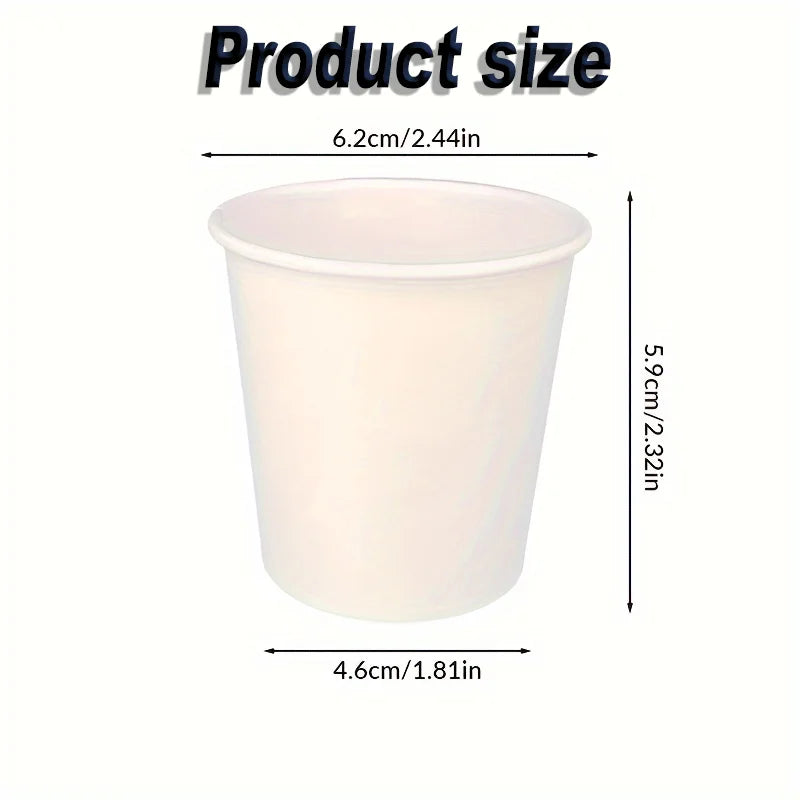 Small disposable paper cup with labeled dimensions in centimeters and inches.